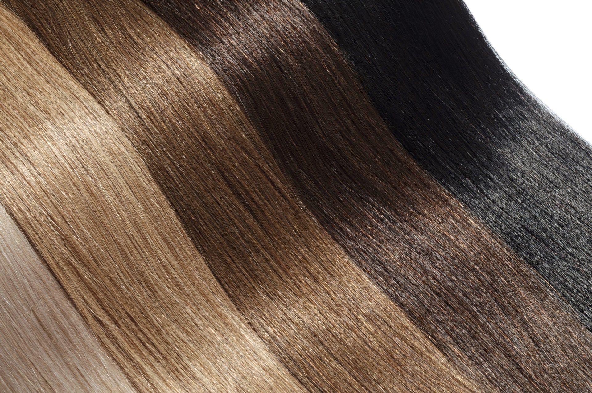 Close up shot on straight hair extensions of various colors