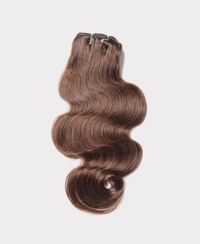 Long wavy hair extensions matching the Hot toffee color