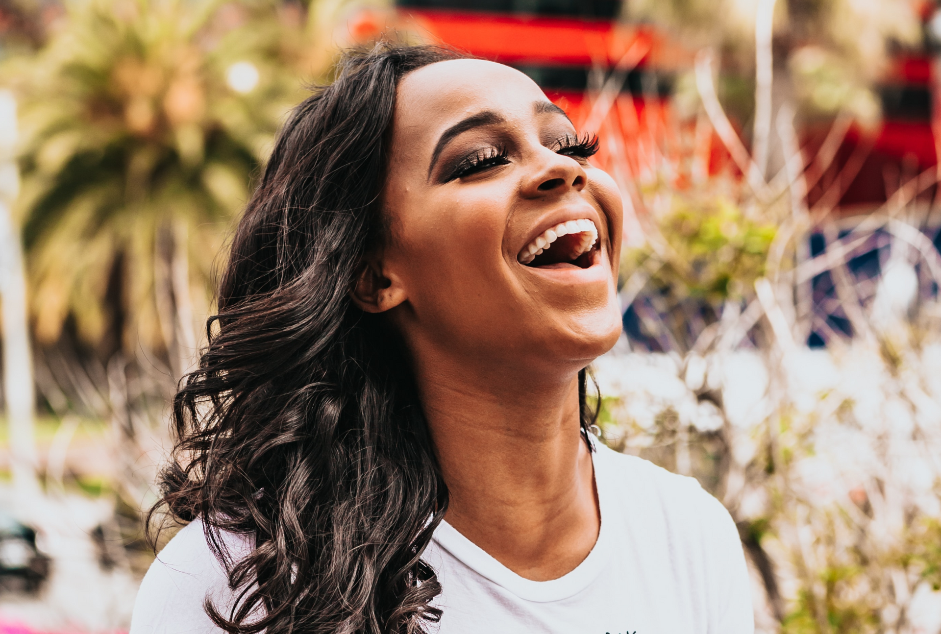 smiling women with long wavy hair extensions