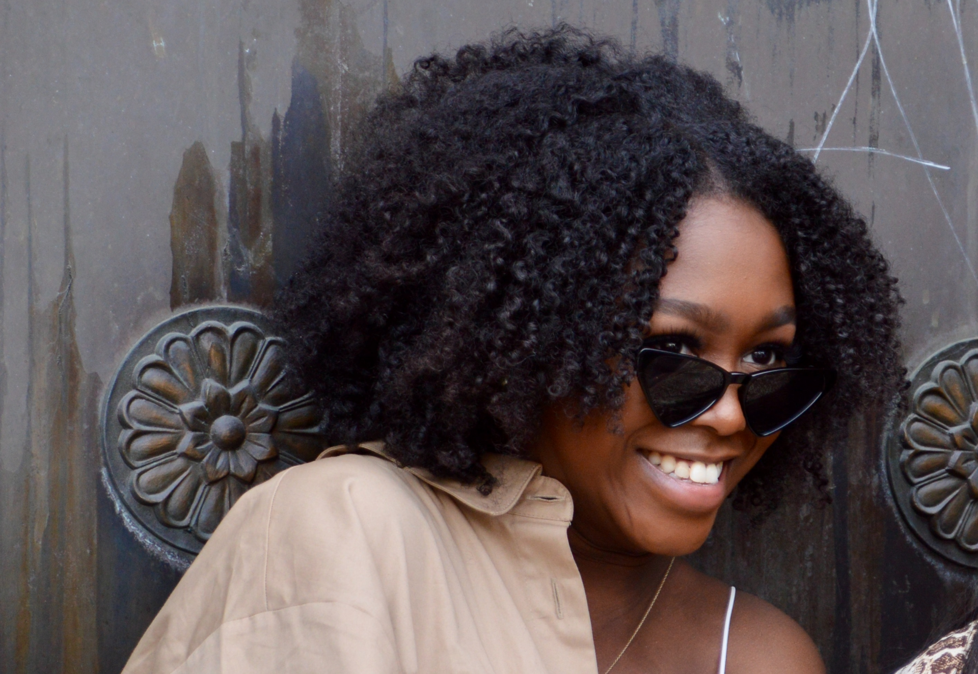 Smiling woman wearing clip-in hair extensions